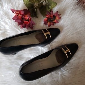 Black heels with gold buckle